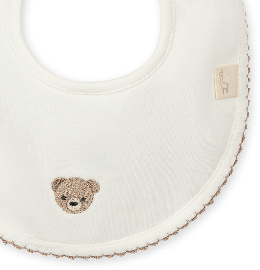 Hvit babysmekke med liten bamse | BabyGi